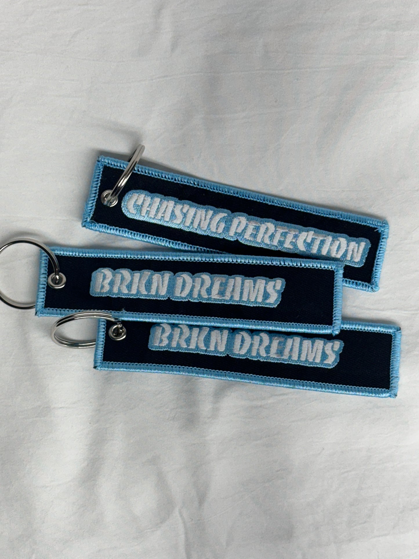 BORDERED JET TAGS