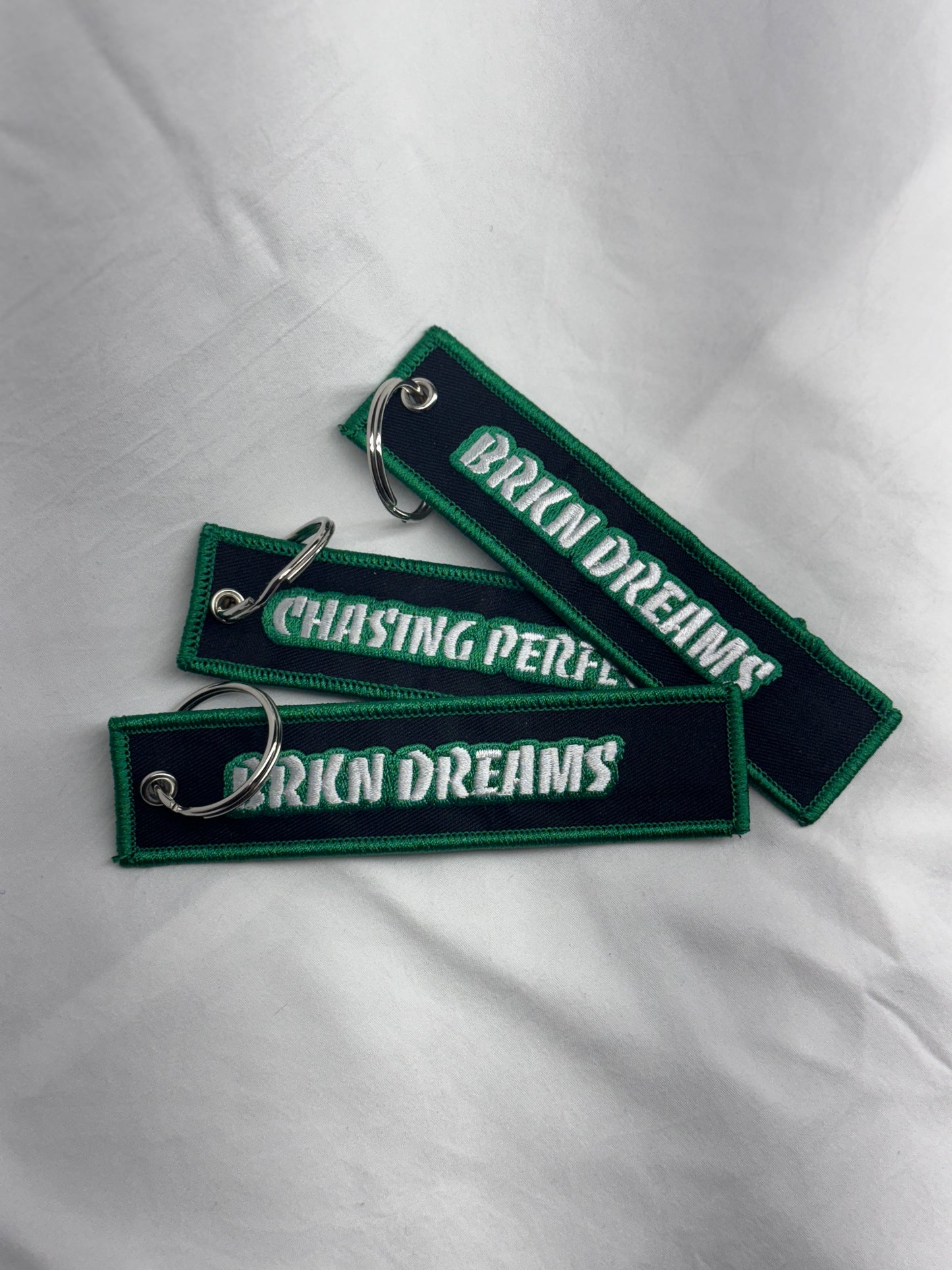 BORDERED JET TAGS