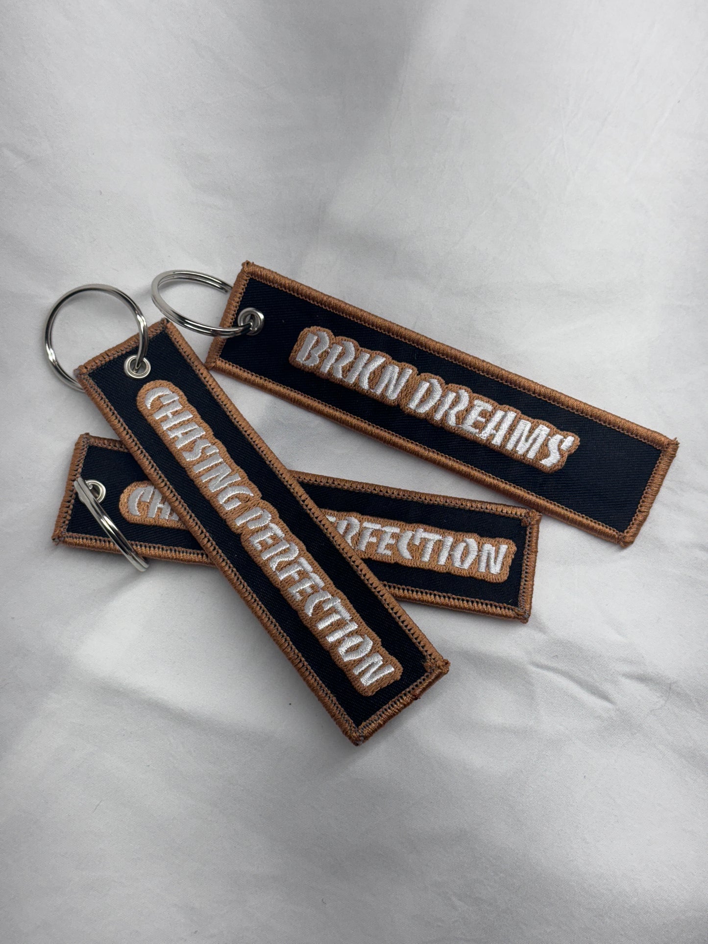 BORDERED JET TAGS